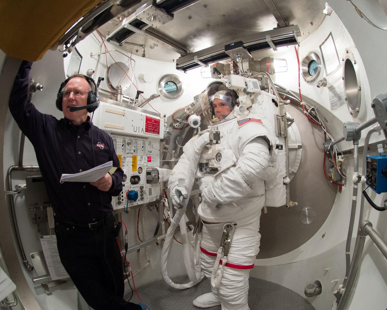 PHOTO DATE: 01-09-14 LOCATION: Bldg. 7 - SSATA Chamber SUBJECT: SSATA crew training and certification for Increment 40 astronaut Greg Wiseman with astronaut Barry Wilmore assisting. PHOTOGRAPHER: BILL STAFFORD