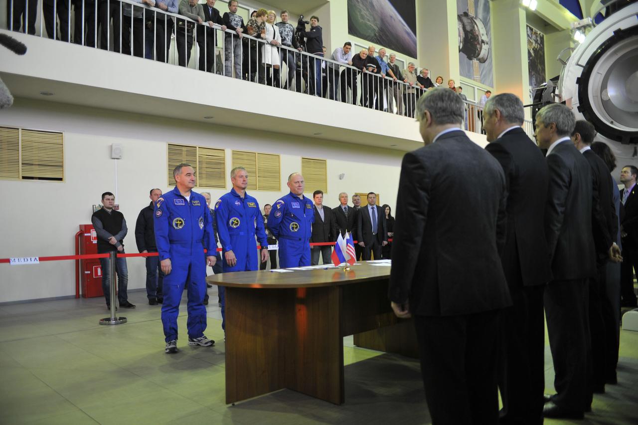 At the Gagarin Cosmonaut Training Center in Star City, Russia, Expedition 39/40 Soyuz Commander Alexander Skvortsov (left), Flight Engineer Steve Swanson of NASA (center) and Flight Engineer Oleg Artemyev of Roscosmos listen to instructions from Russian space officials at the start of qualification exams March 4. The trio is preparing for launch to the International Space Station from the Baikonur Cosmodrome in Kazakhstan on March 26, Kazakh time in their Soyuz TMA-12M spacecraft for a six-month mission.  NASA/Stephanie Stoll 