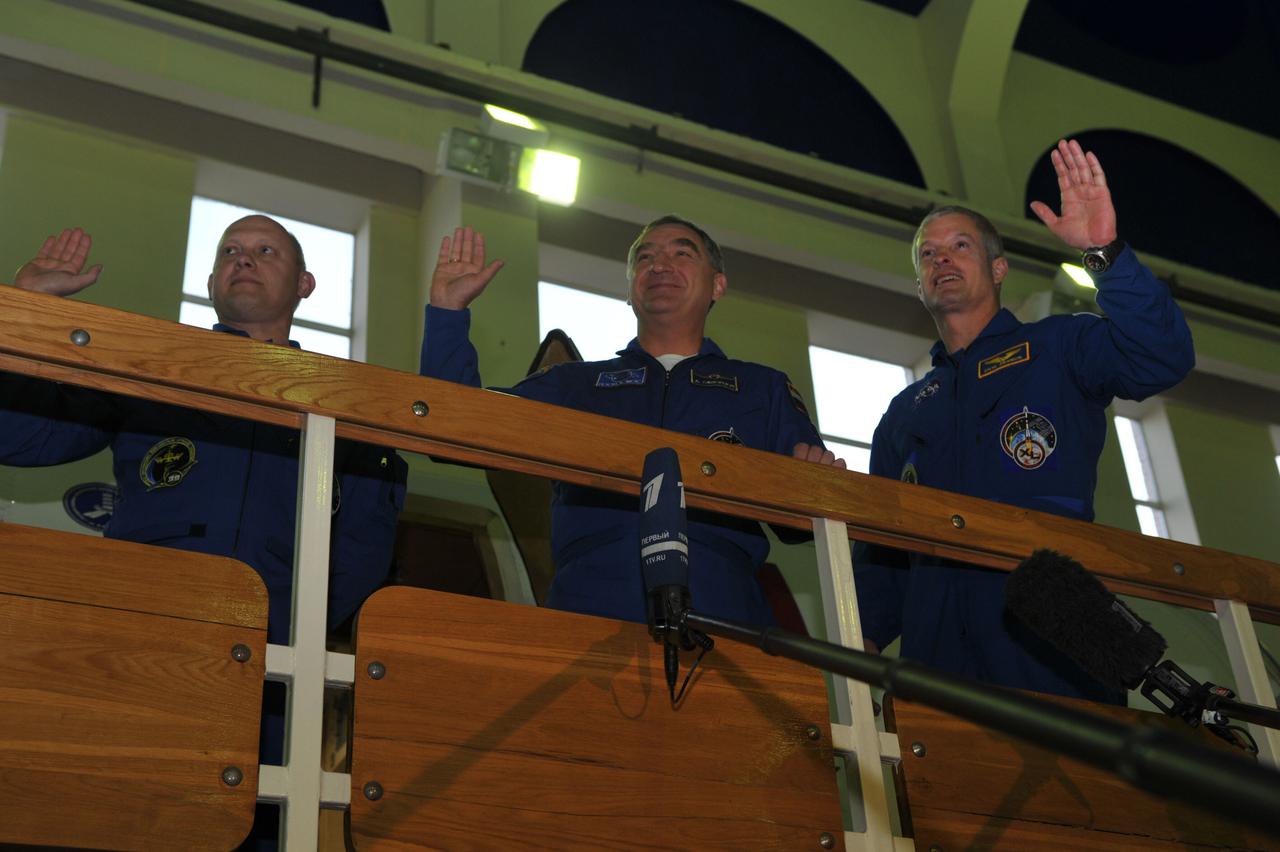 At the Gagarin Cosmonaut Training Center in Star City, Russia, Expedition 39/40 Flight Engineer Oleg Artemyev of Roscosmos (left), Soyuz Commander Alexander Skvortsov (center) and NASA Flight Engineer Steve Swanson (right) wave to reporters March 4 at the start of two days of qualification exams. The trio is preparing for launch to the International Space Station from the Baikonur Cosmodrome in Kazakhstan on March 26, Kazakh time in their Soyuz TMA-12M spacecraft for a six-month mission.  NASA/Stephanie Stoll 