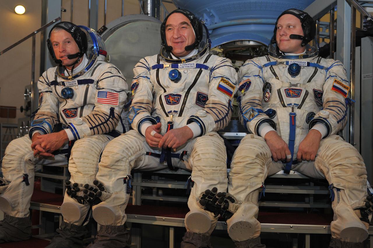 At the Gagarin Cosmonaut Training Center in Star City, Russia, Expedition 39/40 Flight Engineer Steve Swanson of NASA (left), Soyuz Commander Alexander Skvortsov of Roscosmos (center) and Oleg Artemyev of Roscosmos (right) field questions from reporters March 5 prior to qualification exams. They are preparing for their launch to the International Space Station from the Baikonur Cosmodrome in Star City, Russia March 26, Kazakh time, on the Soyuz TMA-12M spacecraft for a six-month mission.  NASA/Stephanie Stoll 
