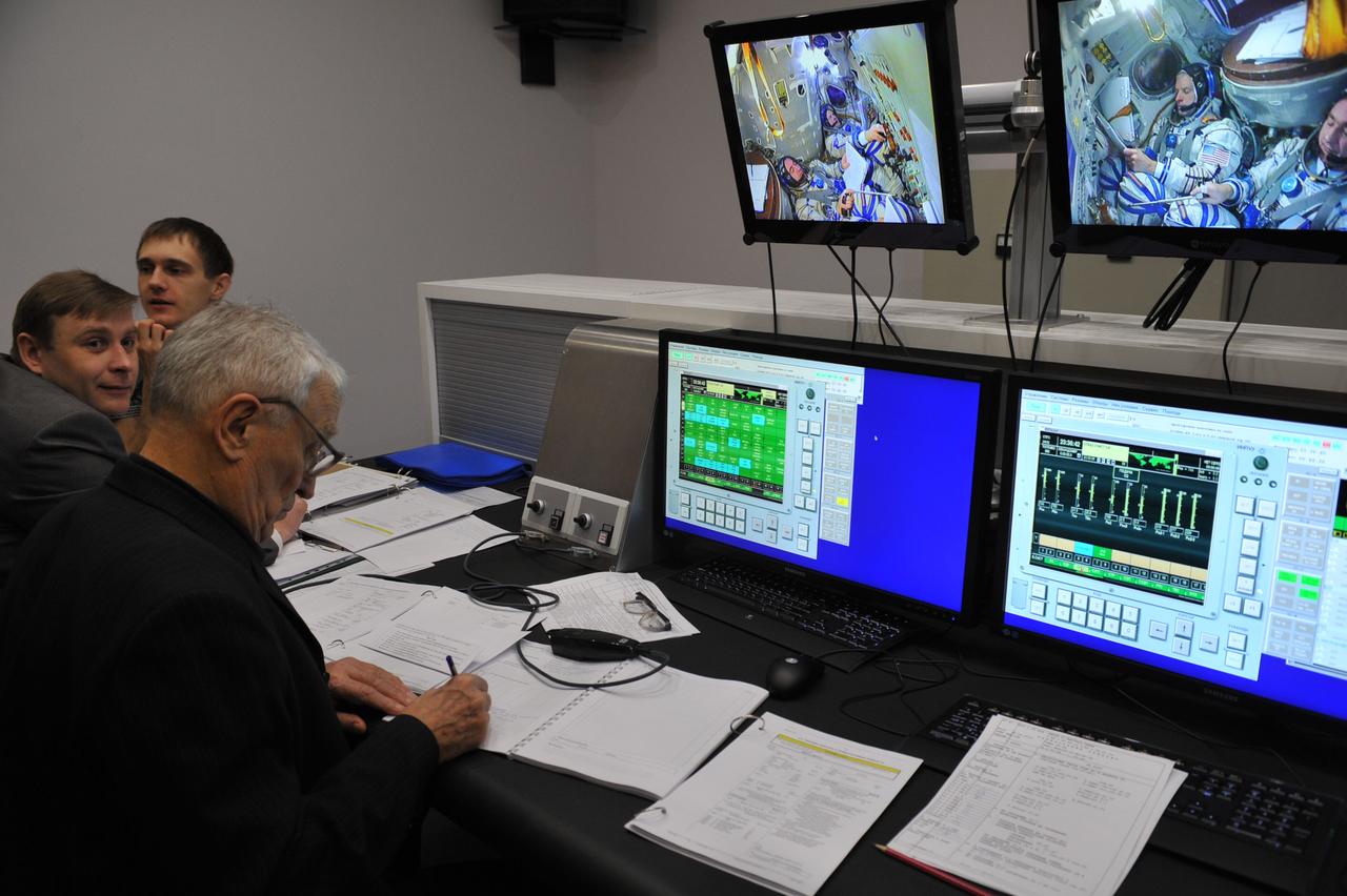 At the Gagarin Cosmonaut Training Center in Star City, Russia, flight instructors monitor the progress of qualification exams for the Expedition 39/40 crewmembers March 5 as the crew heads into the homestretch of its training. Flight Engineer Steve Swanson of NASA, Soyuz Commander Alexander Skvortsov of Roscosmos and Oleg Artemyev of Roscosmos are preparing for their launch to the International Space Station from the Baikonur Cosmodrome in Star City, Russia March 26, Kazakh time, on the Soyuz TMA-12M spacecraft for a six-month mission.  NASA/Stephanie Stoll 
