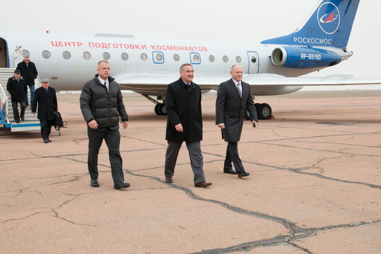 Expedition 39/40 Flight Engineer Steve Swanson of NASA (left), Soyuz Commander Alexander Skvortsov of the Russian Federal Space Agency (Roscosmos; center) and Flight Engineer Oleg Artemyev of Roscosmos (right) step off their plane after arriving at the Baikonur Cosmodrome in Kazakhstan March 13 following a flight from their training base in Star City, Russia. Swanson, Artemyev and Skvortsov are preparing for their launch to the International Space Station March 26, Kazakh time, in their Soyuz TMA-12M spacecraft for a six-month mission. NASA/Victor Zelentsov