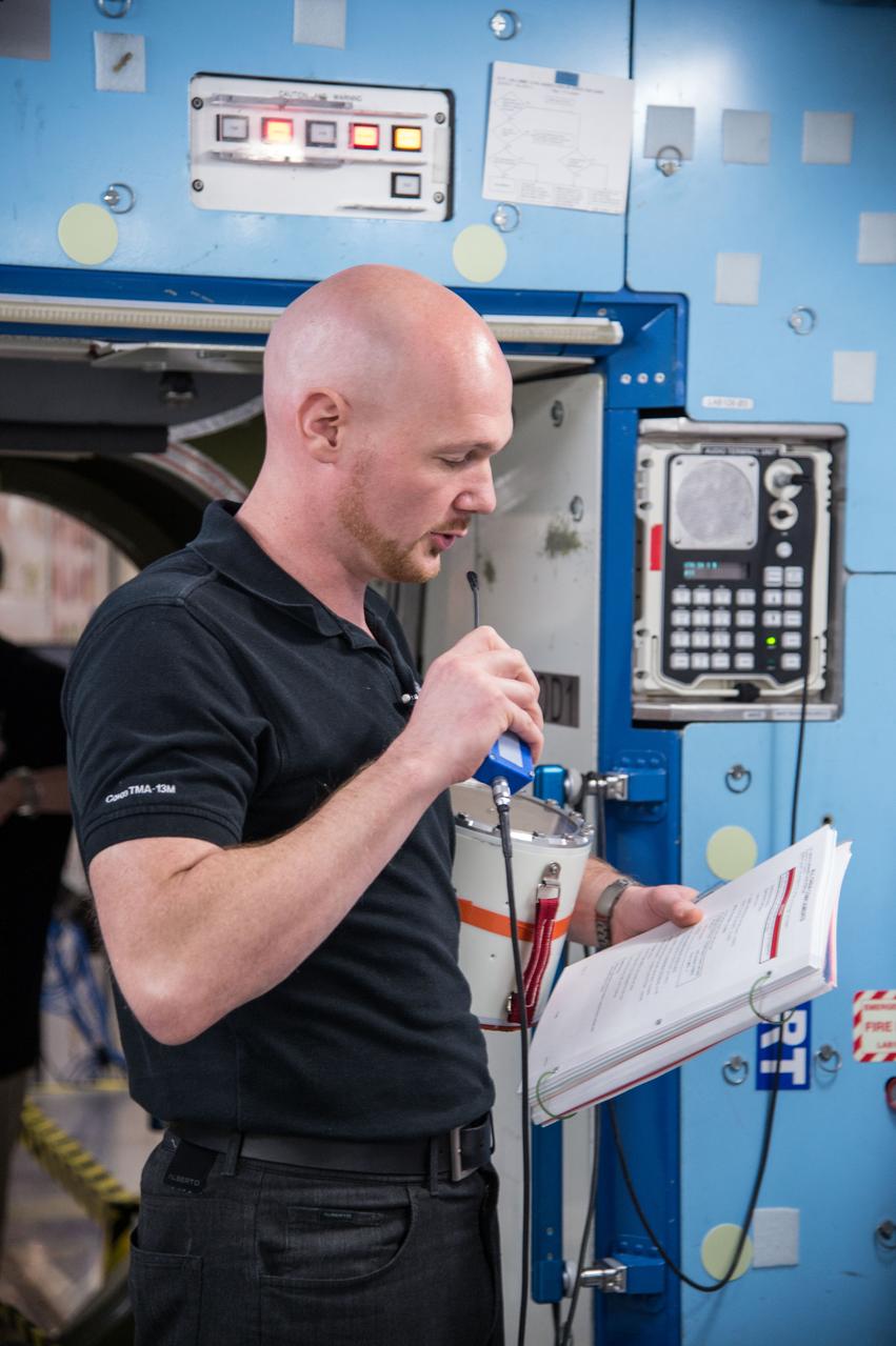 PHOTO DATE:   03-12-14 LOCATION:   Bldg. 9NW - ISS Mockups SUBJECT: Expedition 41 crew (Soyuz 39)with Suraev, Wiseman, Gerst for 3 person emergency scenarios training in the ISS mockups. PHOTOGRAPHER:   BILL STAFFORD