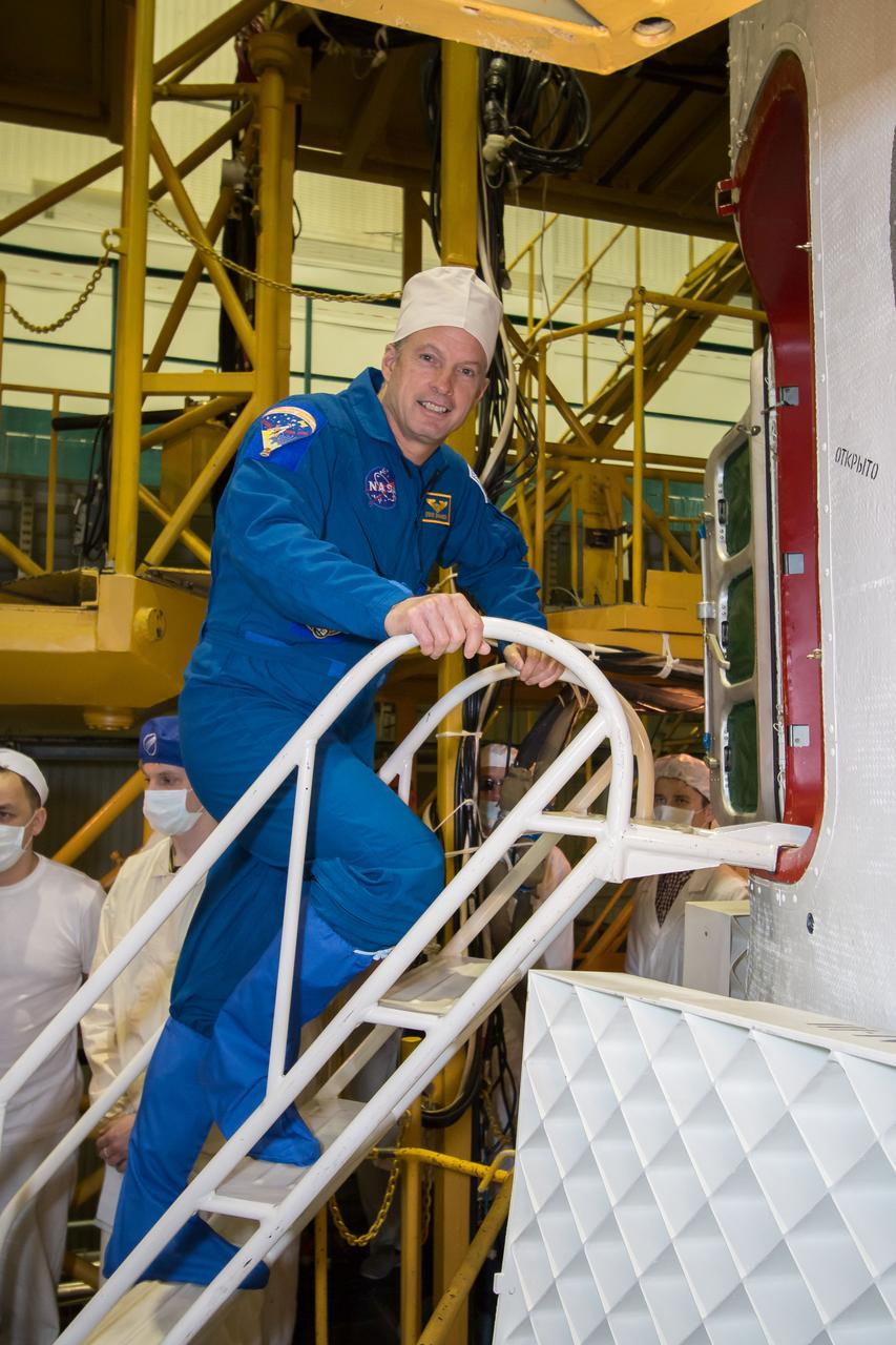 10-37-11-3:  In the Integration Facility at the Baikonur Cosmodrome in Kazakhstan, Expedition 39/40 Flight Engineer Steve Swanson of NASA boards his Soyuz TMA-12M spacecraft March 21 as he and his crewmates wrapped of training for their upcoming launch to the International Space Station. Swanson, Soyuz Commander Alexander Skvortsov of the Russian Federal Space Agency (Roscosmos) and Flight Engineer Oleg Artemyev of Roscosmos  are scheduled to launch March 26, Kazakh time, for a six-month mission on the orbital laboratory.  NASA/Victor Zelentsov 