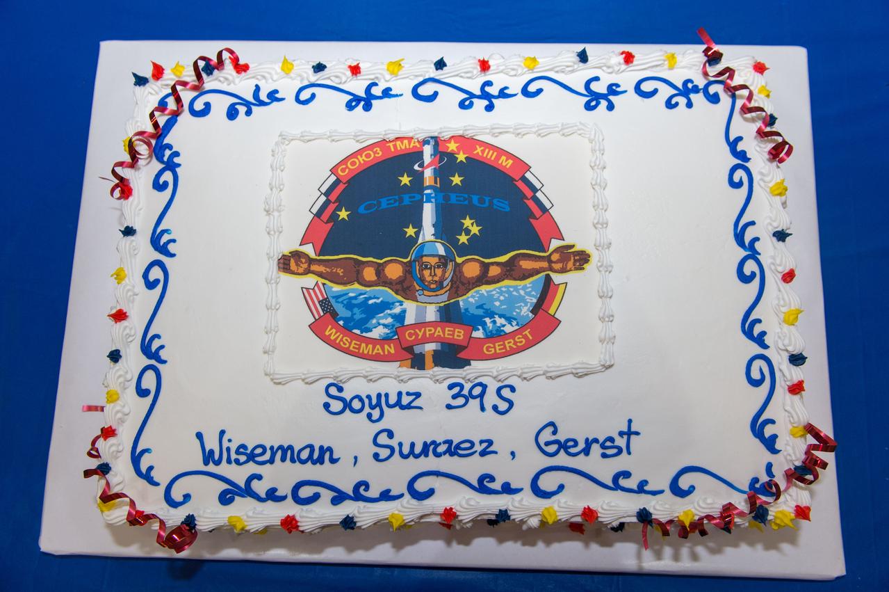 PHOTO DATE: 3-19-14 LOCATION: Bldg. 5 - High Bay SUBJECT: Soyuz 39 crew members (Expedition 41), Maxim Suraev, Greg Wiseman, Alexander Gerst during SSTF Cake Cutting Ceremony marking the end of their training. PHOTOGRAPHER: Lauren Harnett