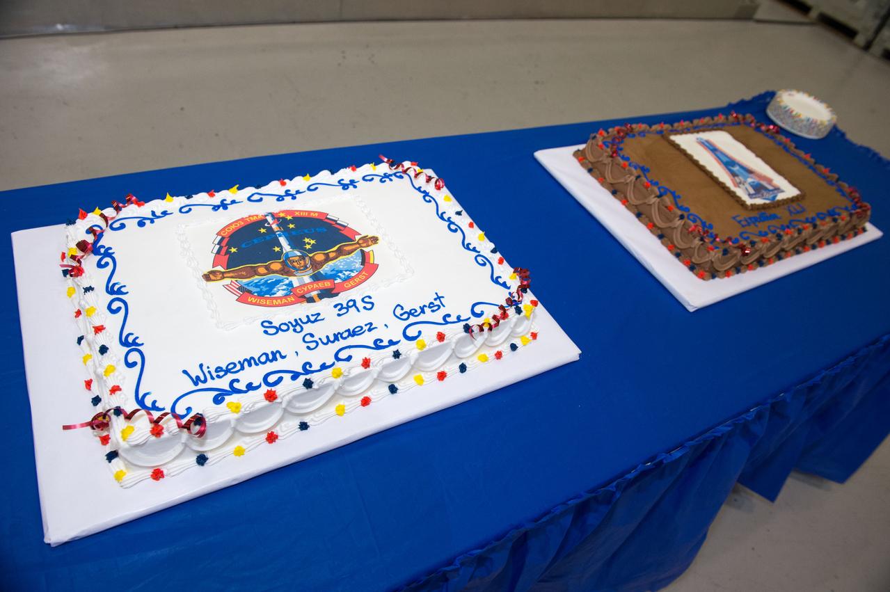 PHOTO DATE: 3-19-14 LOCATION: Bldg. 5 - High Bay SUBJECT: Soyuz 39 crew members (Expedition 41), Maxim Suraev, Greg Wiseman, Alexander Gerst during SSTF Cake Cutting Ceremony marking the end of their training. PHOTOGRAPHER: Lauren Harnett