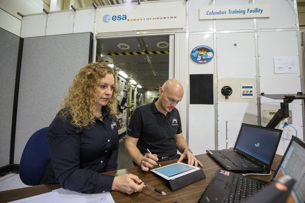 PHOTO DATE: 03/28/14 LOCATION: B5 SSTF SUBJECT: Michaela Benda training ESA astronaut and Expedition 41 crew member during Columbus module training PHOTOGRAPHER: GEESEMAN