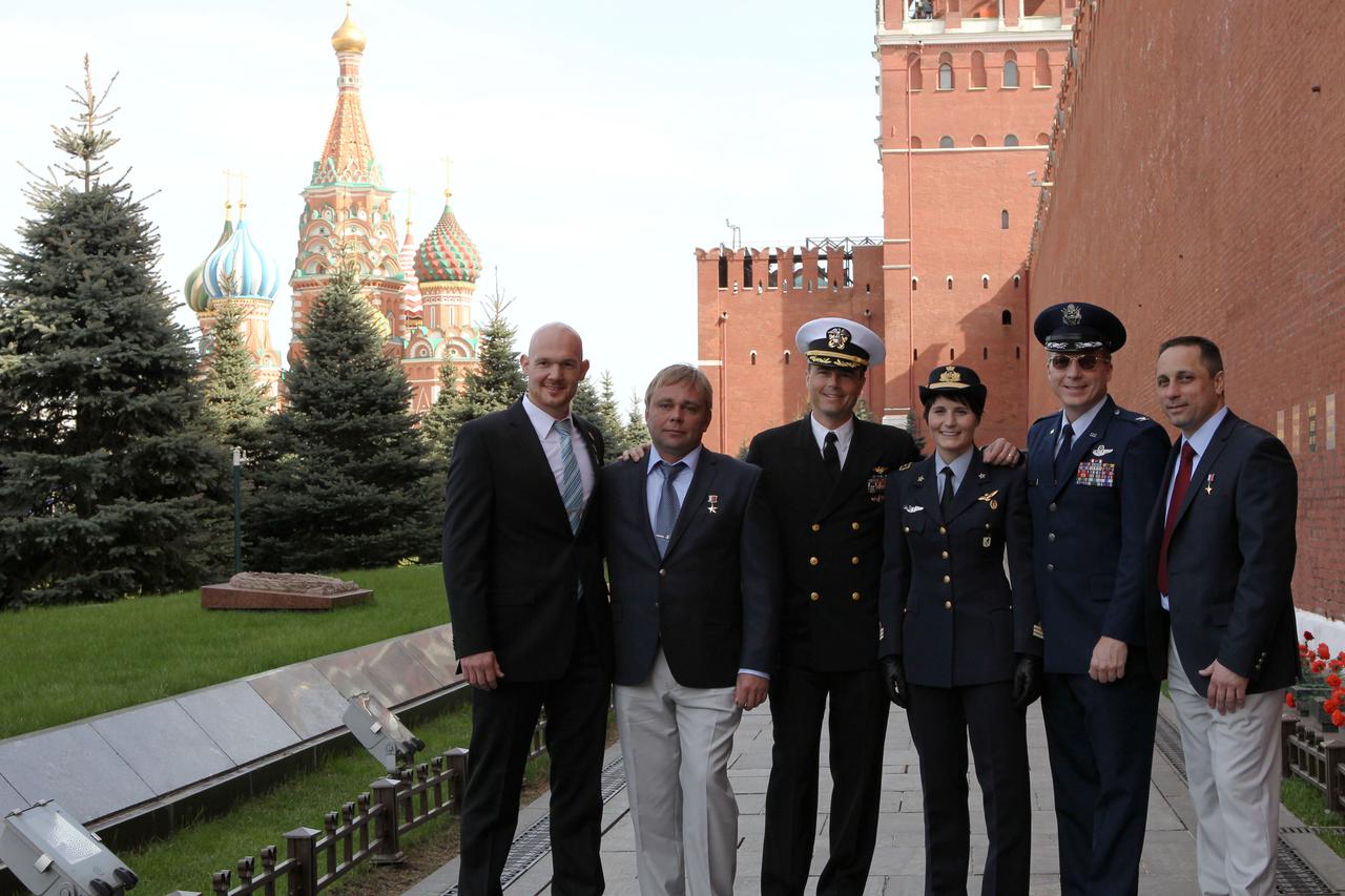 1262:  With St. Basil’s Cathedral in Moscow’s Red Square in the background, the Expedition 40/41 prime and backup crewmembers pose for pictures at the Kremlin Wall May 8 after laying flowers at the spot where Russian space icons are interred. From left to right are prime crewmembers Alexander Gerst of the European Space Agency, Max Suraev of the Russian Federal Space Agency (Roscosmos) and Reid Wiseman of NASA and backup crewmembers Samantha Cristoforetti of the European Space Agency, Terry Virts of NASA and Anton Shkaplerov of Roscosmos. Gerst, Suraev and Wiseman are preparing for launch May 29, Kazakh time, in the Soyuz TMA-13M spacecraft from the Baikonur Cosmodrome in Kazakhstan for a 5 ½ month mission on the International Space Station.  NASA/Stephanie Stoll 