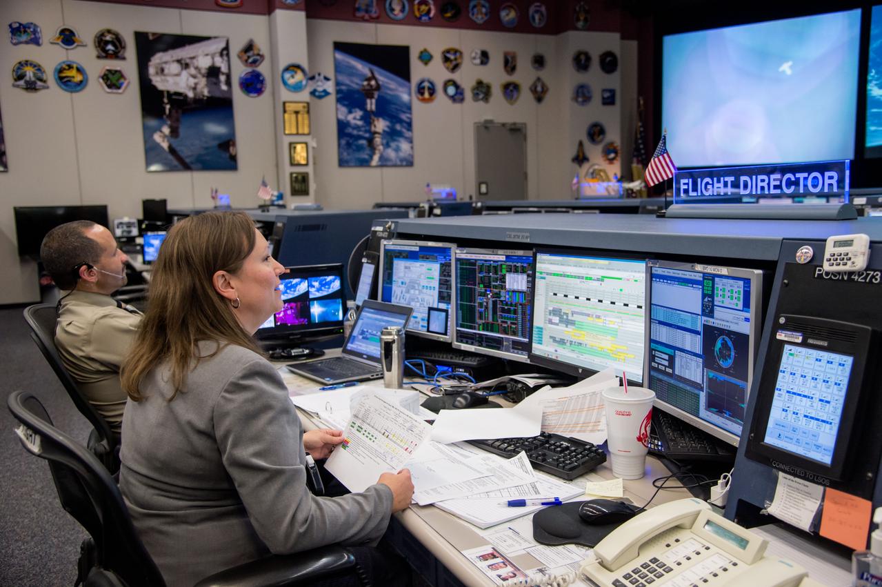 PHOTO DATE: 5-13-14 LOCATION: Bldg 30 - FCR-1   SUBJECT: Flight Director Dina Contella and flight controllers on console in FCR-1 during undocking of Expedition 39 crew (Tyurin, Mastracchio, Wakata). PHOTOGRAPHER: Lauren Harnett