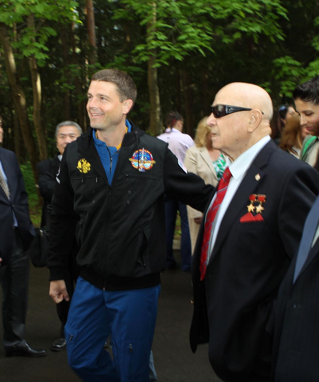 1433A:  At the Gagarin Cosmonaut Training Center in Star City, Russia, Expedition 40/41 Flight Engineer Reid Wiseman of NASA (left) shares a special moment with former cosmonaut Alexey Leonov, the first human to walk in space, during ceremonies May 15 to mark the crew’s departure for their launch site at the Baikonur Cosmodrome in Kazakhstan for final pre-launch training. Wiseman, Soyuz Commander Max Suraev of the Russian Federal Space Agency (Roscosmos) and Flight Engineer Alexander Gerst of the European Space Agency will launch on May 29, Kazakh time, in the Soyuz TMA-13M spacecraft from Baikonur for a 5 ½ month mission on the International Space Station.  NASA/Stephanie Stoll 