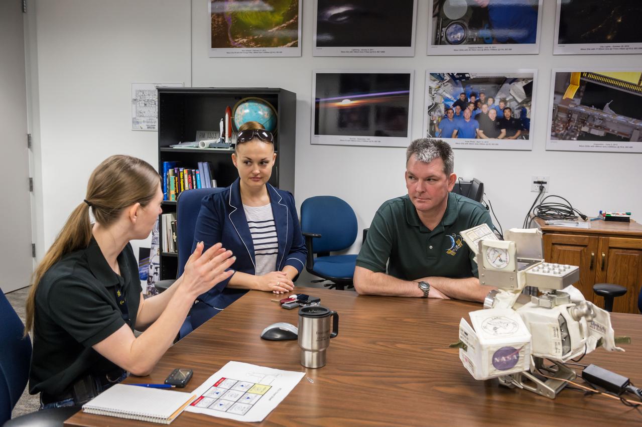 PHOTO DATE: 05/16/14 LOCATION: JSC B4 ROOM 1303 SUBJECT:  Soyuz 40 (Expedition 42) Russian cosmonauts Alexander Samokutyaye and Yelena Serova during EVA IR Camera EQ training with instructor Katrina Willoughby PHOTOGRAPHER: GEESEMAN