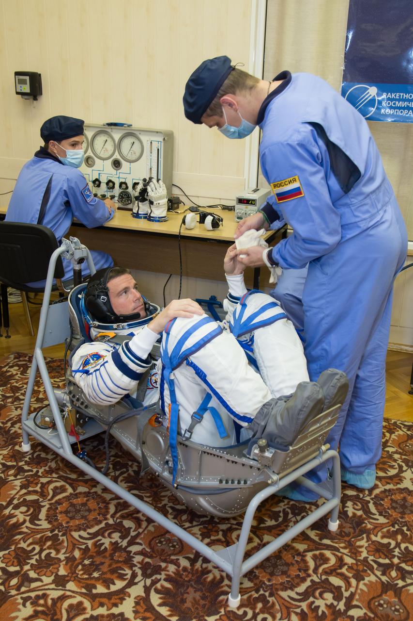 12-41-29: At the Baikonur Cosmodrome in Kazakhstan, Expedition 40/41 Flight Engineer Reid Wiseman of NASA undergoes leak and pressure checks on his Russian Sokol launch and entry suit May 16 during a dress rehearsal “fit check”. Wiseman, Soyuz Commander Max Suraev of the Russian Federal Space Agency (Roscosmos) and Flight Engineer Alexander Gerst of the European Space Agency will launch from Baikonur on May 29, Kazakh time, in the Soyuz TMA-13M spacecraft for a 5 ½ month mission on the International Space Station. NASA/Victor Zelentsov