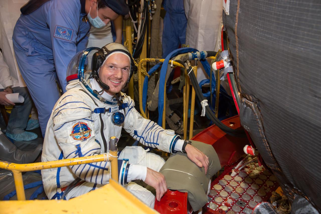 13-17-28-3: At the Baikonur Cosmodrome in Kazakhstan, Expedition 40/41 Flight Engineer Alexander Gerst of the European Space Agency poses for a picture May 16 in his Russian Sokol launch and entry suit as he enters the Soyuz TMA-13M spacecraft during a dress rehearsal “fit check”. Gerst, NASA Flight Engineer Reid Wiseman and Soyuz Commander Max Suraev of the Russian Federal Space Agency (Roscosmos) will launch from Baikonur on May 29, Kazakh time, for a 5 ½ month mission on the International Space Station. NASA/Victor Zelentsov