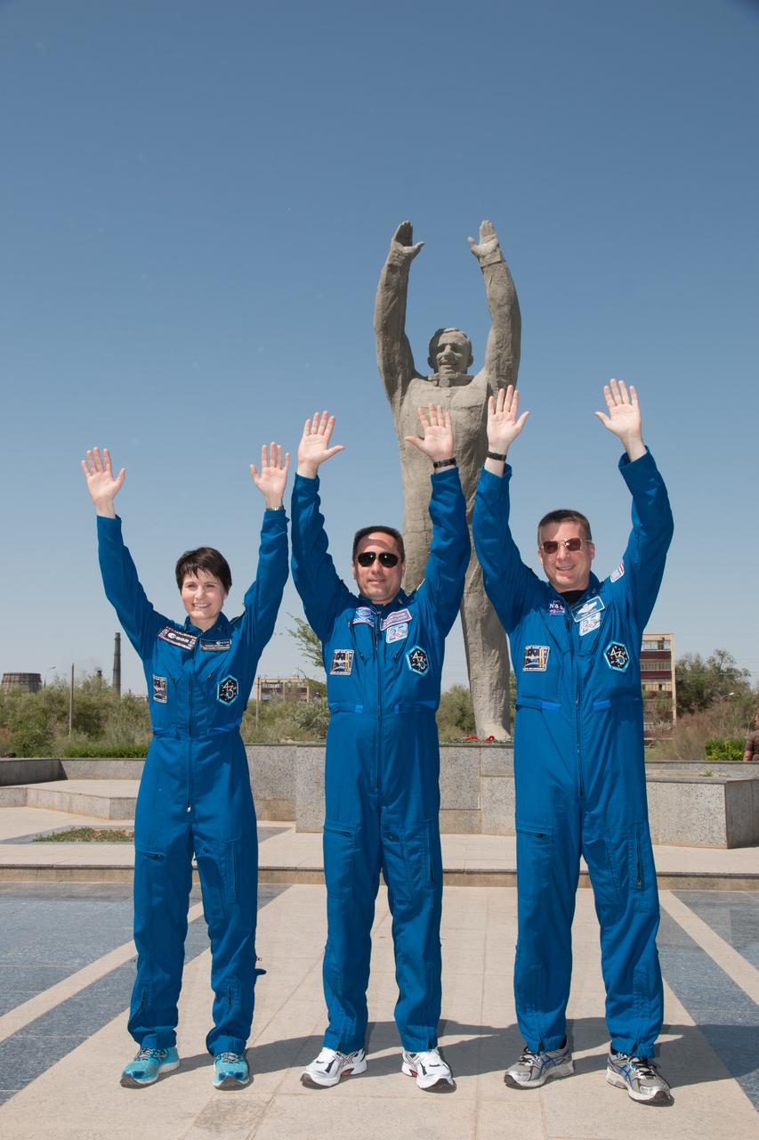 12-15-05: In front of the statue of Yuri Gagarin, the first human in space, in the town of Baikonur, Kazakhstan, Expedition 40/41 backup crewmembers Samantha Cristoforetti of the European Space Agency (left), Anton Shkaplerov of the Russian Federal Space Agency (Roscosmos, center) and Terry Virts of NASA (right) mimic Gagarin’s pose during a photo opportunity May 17. The trio is backing up the prime crew, Flight Engineer Alexander Gerst of the European Space Agency, Soyuz Commander Max Suraev of the Russian Federal Space Agency (Roscosmos) and NASA Flight Engineer Reid Wiseman, who will launch from Baikonur on May 29, Kazakh time, for a 5 ½ month mission on the International Space Station. NASA/Victor Zelentsov