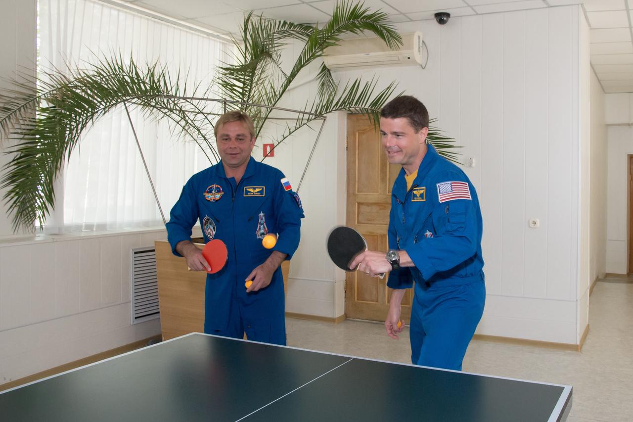 11-52-21:  At the Cosmonaut Hotel crew quarters in Baikonur, Kazakhstan, Expedition 40/41 Soyuz Commander Max Suraev of the Russian Federal Space Agency (Roscosmos, left) and NASA Flight Engineer Reid Wiseman (right) try their hand at a game of Ping-Pong May 21 as they head into the homestretch of their pre-launch training. Suraev, Wiseman and Flight Engineer Alexander Gerst of the European Space Agency (right) will launch on May 29, Kazakh time, on the Soyuz TMA-13M spacecraft from the Baikonur Cosmodrome for a 5 ½ month mission on the International Space Station.  NASA/Victor Zelentsov 