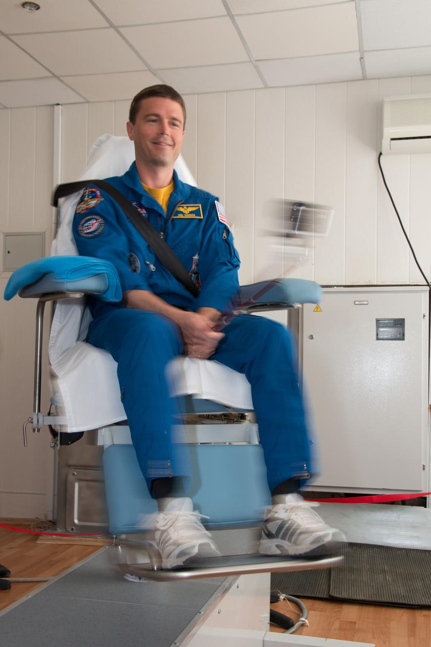 11-56-02-4:  At the Cosmonaut Hotel crew quarters in Baikonur, Kazakhstan, Expedition 40/41 Flight Engineer Reid Wiseman of NASA takes a ride in a spinning chair May 21 as he tests his vestibular system during pre-launch medical tests. Wiseman, Soyuz Commander Max Suraev of the Russian Federal Space Agency (Roscosmos) and Flight Engineer Alexander Gerst of the European Space Agency will launch on May 29, Kazakh time, on the Soyuz TMA-13M spacecraft from the Baikonur Cosmodrome for a 5 ½ month mission on the International Space Station.  NASA/Victor Zelentsov 