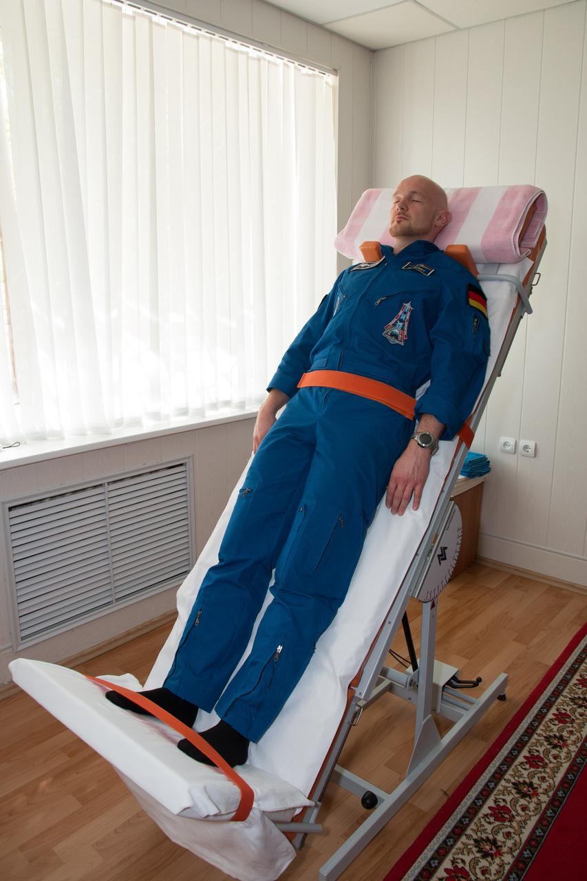 11-57-29-2:  At the Cosmonaut Hotel crew quarters in Baikonur, Kazakhstan, Expedition 40/41 Flight Engineer Alexander Gerst of the European Space Agency takes a turn on a tilt table May 21 as he tests his vestibular system during pre-launch medical tests. Gerst, Soyuz Commander Max Suraev of the Russian Federal Space Agency (Roscosmos) and Flight Engineer Reid Wiseman of NASA will launch on May 29, Kazakh time, on the Soyuz TMA-13M spacecraft from the Baikonur Cosmodrome for a 5 ½ month mission on the International Space Station.  NASA/Victor Zelentsov 
