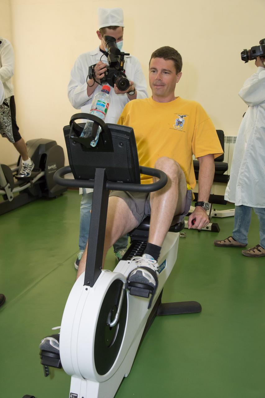 13-04-55-2: At the Cosmonaut Hotel crew quarters in Baikonur, Kazakhstan, Expedition 40/41 Flight Engineer Reid Wiseman of NASA gets in some exercise May 21 during pre-launch medical tests. Wiseman, Soyuz Commander Max Suraev of the Russian Federal Space Agency (Roscosmos) and Flight Engineer Alexander Gerst of the European Space Agency will launch on May 29, Kazakh time, on the Soyuz TMA-13M spacecraft from the Baikonur Cosmodrome for a 5 ½ month mission on the International Space Station. NASA/Victor Zelentsov