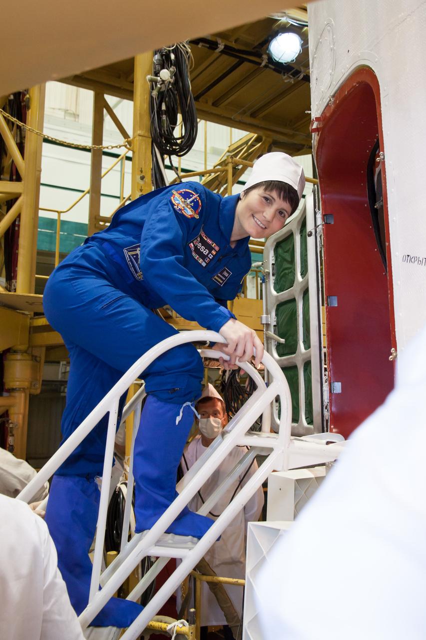 20-28-2: At the Baikonur Cosmodrome in Kazakhstan, Expedition 40/41 backup crewmember Samantha Cristoforetti of the European Space Agency poses for pictures as she boards the Soyuz TMA-13M spacecraft May 24 during the final fit check training dress rehearsal. Cristoforetti, Anton Shkaplerov of the Russian Federal Space Agency (Roscosmos) and Terry Virts of NASA are backups to the prime crew --- Reid Wiseman of NASA, Max Suraev of Roscosmos and Alexander Gerst of NASA, who will launch May 29, Kazakh time, on the Soyuz TMA-13M spacecraft for a 5 ½ month mission on the International Space Station. NASA/Victor Zelentsov