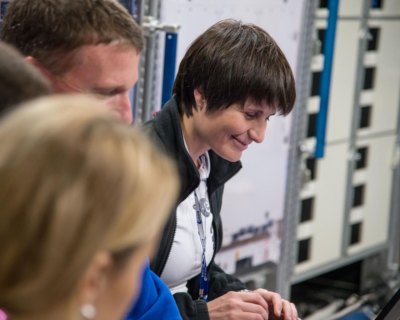 PHOTO DATE:  06-27-14 LOCATION:  Bldg. 9NW - ISS Mockups SUBJECT:  Expedition 42/43 (Soyuz 41) crew members Terry Virts, Samantha Cristoforetti and Anton Shakaplerov during Mega Code 2 training with instructor Melinda Hailey. PHOTOGRAPHER:  BILL STAFFORD