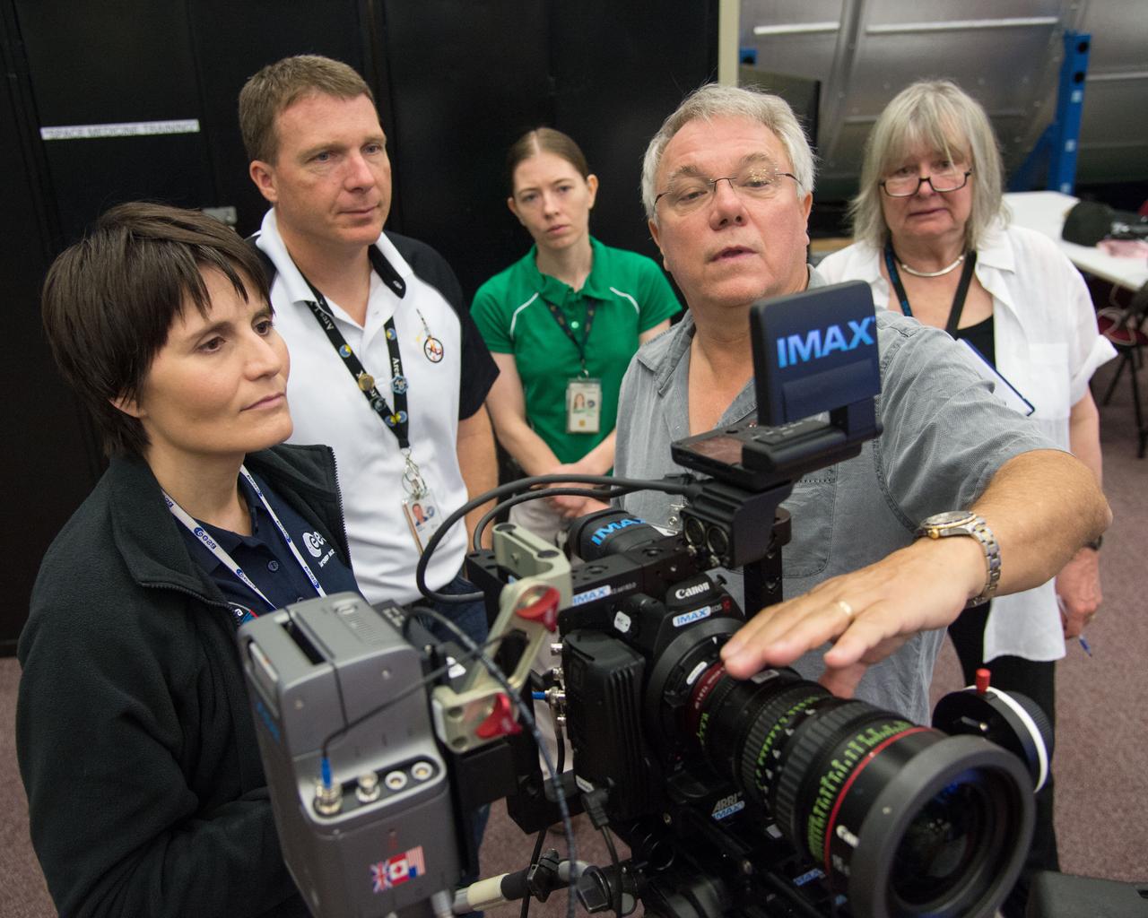 DATE: 6-26-14 LOCATION: Bldg 9NW SUBJECT: Expedition 42/43 crew members Samantha Cristoforetti (ESA) and Terry Virts (NASA) performing IMAX C-500 cinematography training with instructors James Neihouse and Toni Myers. PHOTOGRAPHER: Lauren Harnett