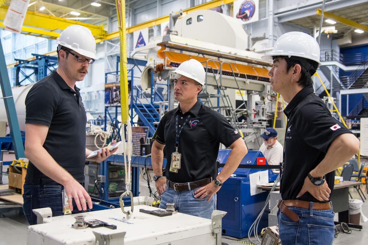 Date: 07-01-14 Location: Bldg 9NW, POGO station Subject: Expedition 44/45 crew members Kjell Lindgren and JAXA astronaut Kimiya Yui during ISS EVA Hi-Fi Hardware 2 training with instructor Scott Way Photographer: James Blair