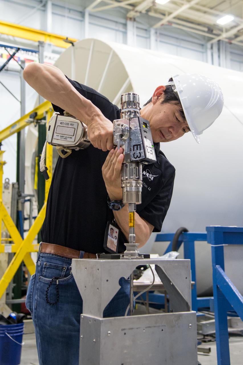 Date: 07-01-14 Location: Bldg 9NW, POGO station Subject: Expedition 44/45 crew members Kjell Lindgren and JAXA astronaut Kimiya Yui during ISS EVA Hi-Fi Hardware 2 training with instructor Scott Way Photographer: James Blair