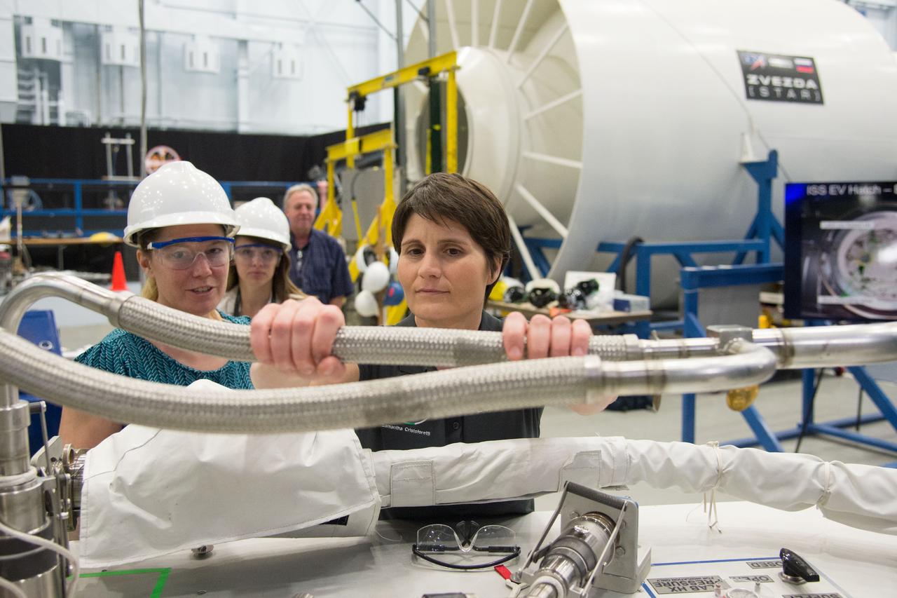 DATE: 6-25-14 LOCATION: Bldg 9NW - POGO SUBJECT: Expedition 42/43 ESA astronaut Samantha Cristoforetti during ISS EVA POGO 2 training with instructor Sandy Fletcher.  PHOTOGRAPHER: Lauren Harnett