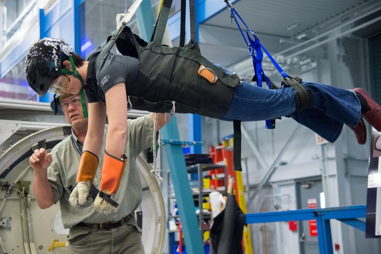 DATE: 6-25-14 LOCATION: Bldg 9NW - POGO SUBJECT: Expedition 42/43 ESA astronaut Samantha Cristoforetti during ISS EVA POGO 2 training with instructor Sandy Fletcher.  PHOTOGRAPHER: Lauren Harnett