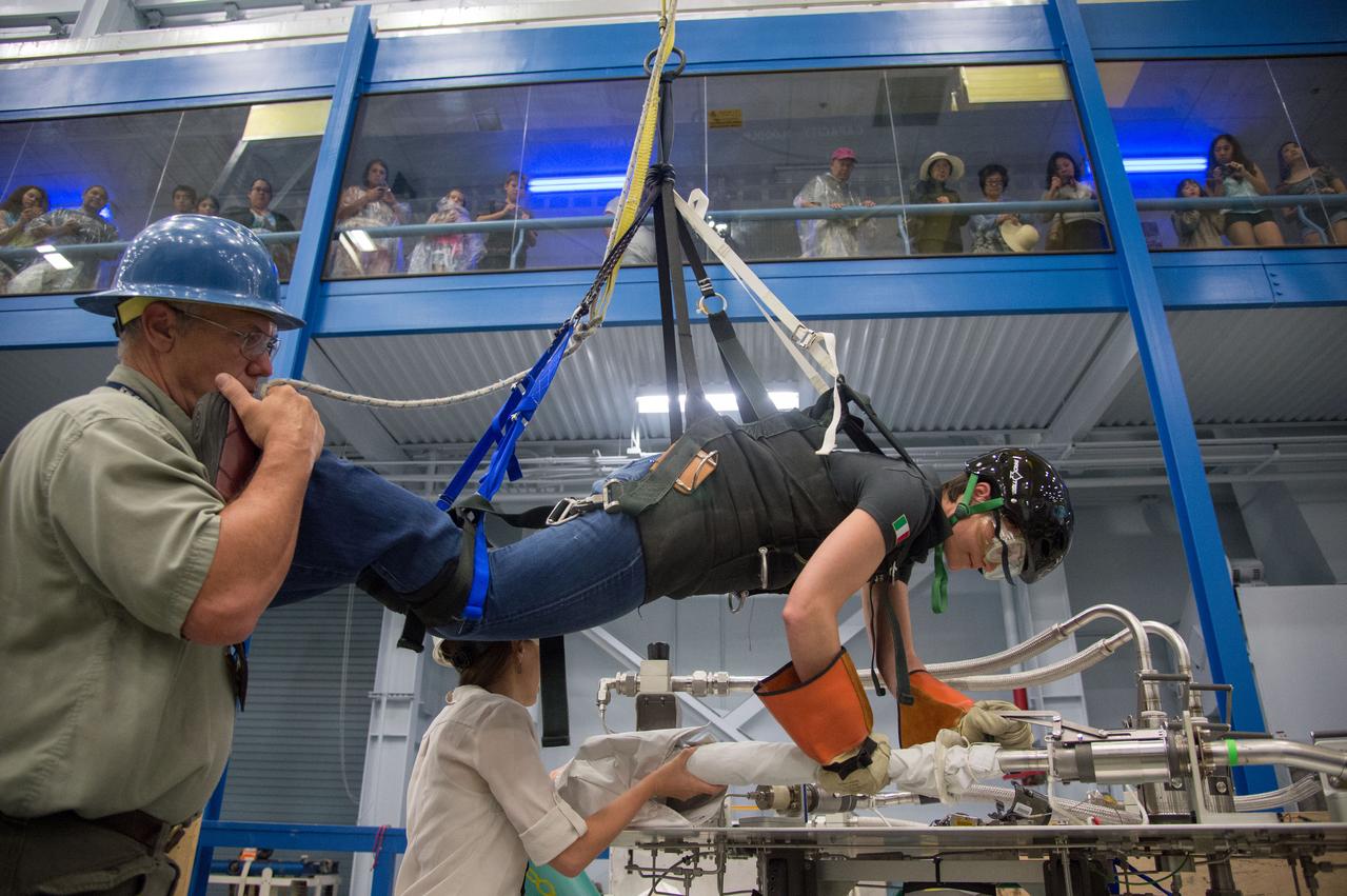 DATE: 6-25-14 LOCATION: Bldg 9NW - POGO SUBJECT: Expedition 42/43 ESA astronaut Samantha Cristoforetti during ISS EVA POGO 2 training with instructor Sandy Fletcher.  PHOTOGRAPHER: Lauren Harnett