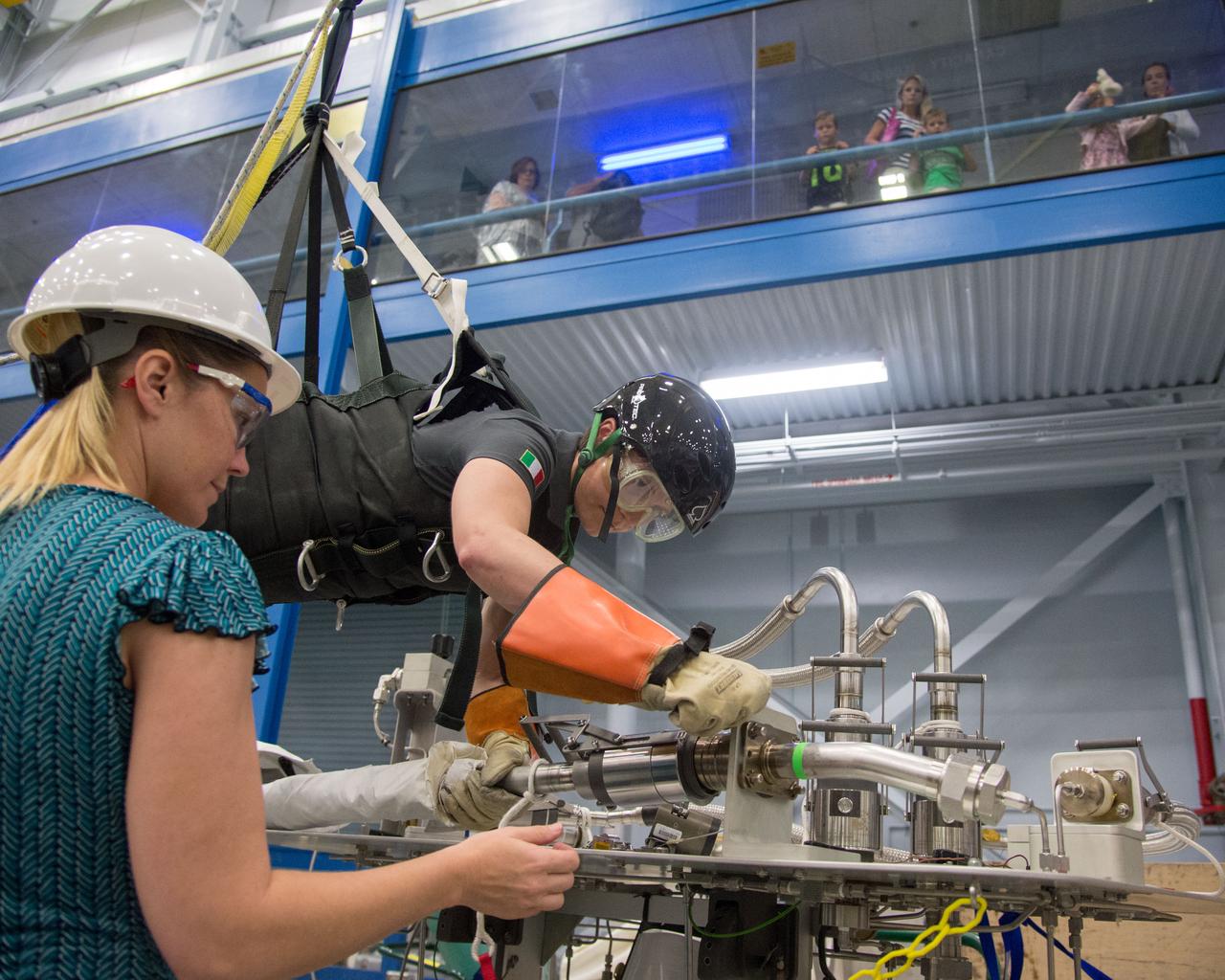 DATE: 6-25-14 LOCATION: Bldg 9NW - POGO SUBJECT: Expedition 42/43 ESA astronaut Samantha Cristoforetti during ISS EVA POGO 2 training with instructor Sandy Fletcher.  PHOTOGRAPHER: Lauren Harnett