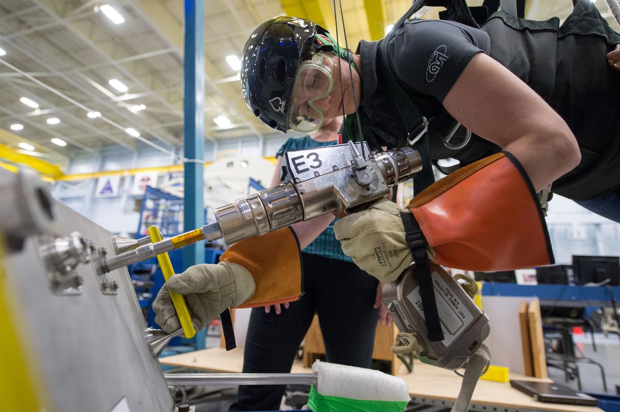 DATE: 6-25-14 LOCATION: Bldg 9NW - POGO SUBJECT: Expedition 42/43 ESA astronaut Samantha Cristoforetti during ISS EVA POGO 2 training with instructor Sandy Fletcher. PHOTOGRAPHER: Lauren Harnett