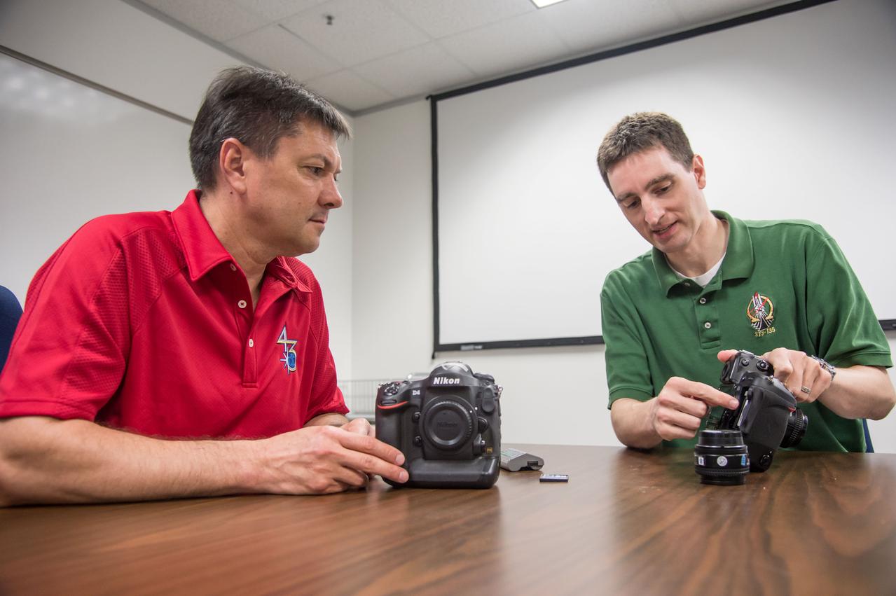 PHOTO DATE:  7-1-14 LOCATION:  Bldg. 4south, Room 1303 SUBJECT: 43S/Expedition 44/45 crew member Oleg Kononenko during Nikon D4 EQ# training with instructor Paul Reichert. PHOTOGRAPHER: Lauren Harnett