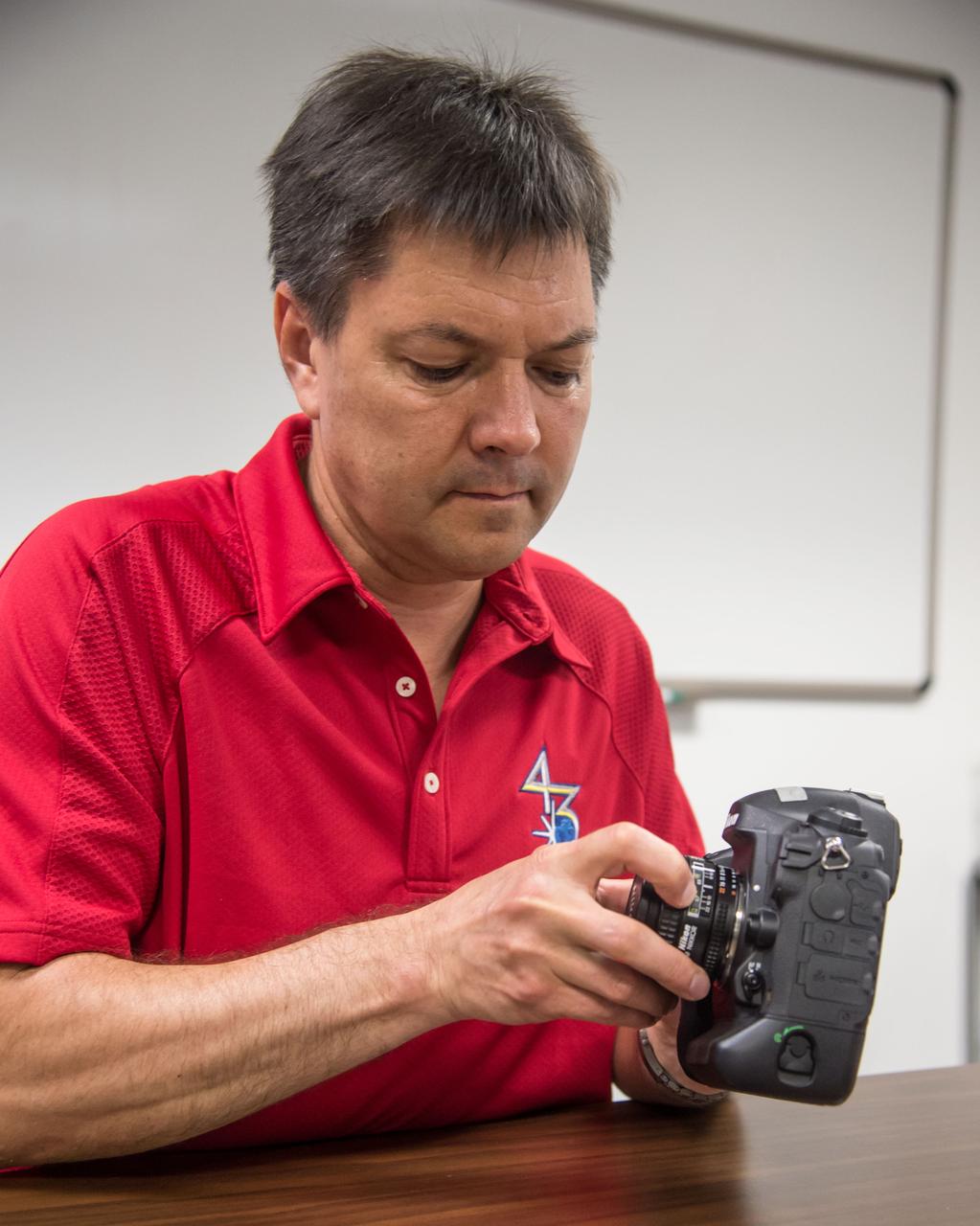 PHOTO DATE:  7-1-14 LOCATION:  Bldg. 4south, Room 1303 SUBJECT: 43S/Expedition 44/45 crew member Oleg Kononenko during Nikon D4 EQ# training with instructor Paul Reichert. PHOTOGRAPHER: Lauren Harnett