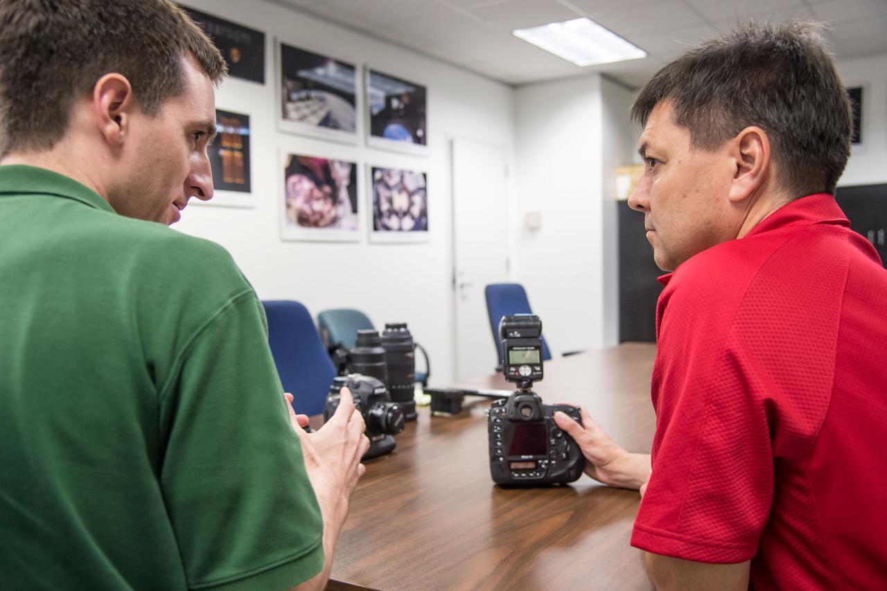 PHOTO DATE:  7-1-14 LOCATION:  Bldg. 4south, Room 1303 SUBJECT: 43S/Expedition 44/45 crew member Oleg Kononenko during Nikon D4 EQ# training with instructor Paul Reichert. PHOTOGRAPHER: Lauren Harnett