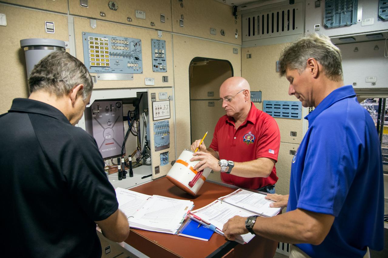 Date: 07-03-14 Location: Bldg 9, ISS Mockups Subject: Soyuz 42S (Expedition 44/45/46) crew members during Emergency Scenarios training in ISS mockups with astronaut Scott Kelly, cosmonauts Mikhail Kornienko and Genady Padalka. Photographer: James Blair