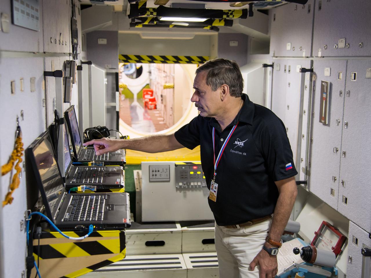 Date: 07-03-14 Location: Bldg 9, ISS Mockups Subject: Soyuz 42S (Expedition 44/45/46) crew members during Emergency Scenarios training in ISS mockups with astronaut Scott Kelly, cosmonauts Mikhail Kornienko and Genady Padalka. Photographer: James Blair