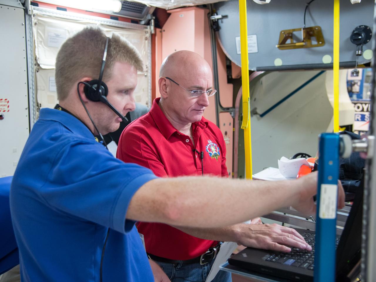Date: 07-03-14 Location: Bldg 9, ISS Mockups Subject: Soyuz 42S (Expedition 44/45/46) crew members during Emergency Scenarios training in ISS mockups with astronaut Scott Kelly, cosmonauts Mikhail Kornienko and Genady Padalka. Photographer: James Blair