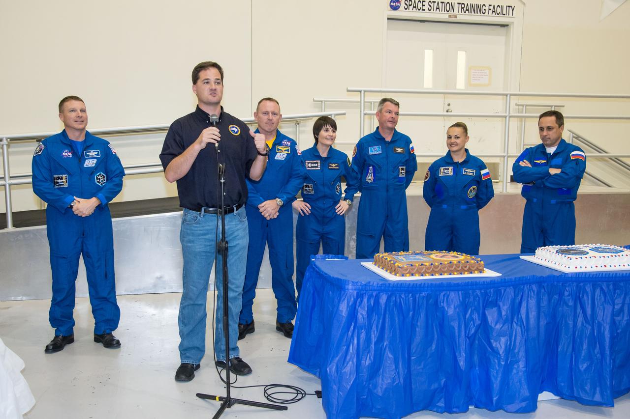PHOTO DATE: 09 July 2014 LOCATION: Bldg. 5 - Space Station Training Facility High Bay SUBJECT: Expedition 42/43 cake cutting ceremony Soyuz 40(Soyuz 40(Alexander Samokutyaev, Yelena Serova, Barry Wilmore) & Soyuz 41(Anton Shkaplerov, Samantha Cristoforetti, Terry Virts) with ISS trainers. PHOTOGRAPHER: Mark Sowa