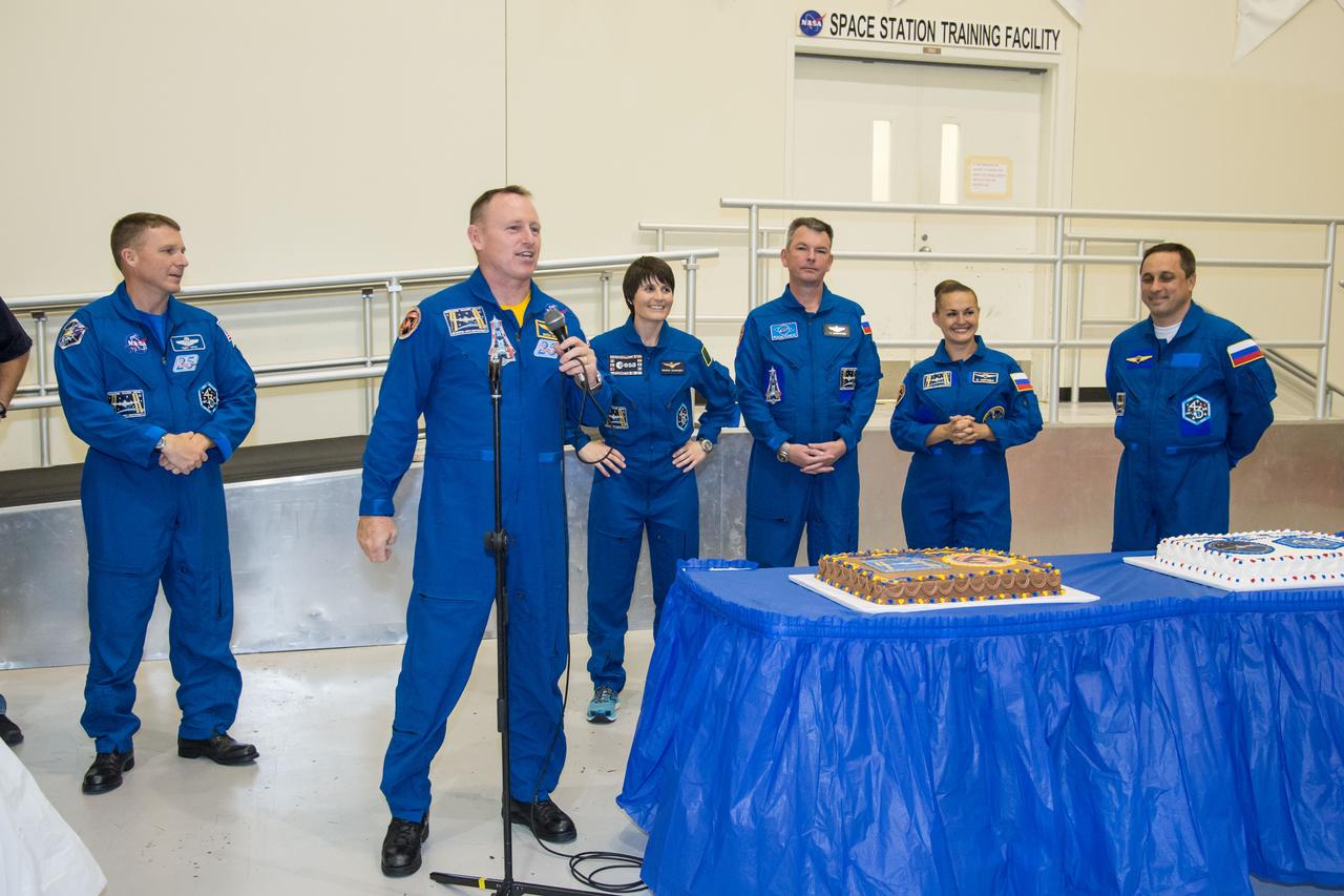 PHOTO DATE: 09 July 2014 LOCATION: Bldg. 5 - Space Station Training Facility High Bay SUBJECT: Expedition 42/43 cake cutting ceremony Soyuz 40(Soyuz 40(Alexander Samokutyaev, Yelena Serova, Barry Wilmore) & Soyuz 41(Anton Shkaplerov, Samantha Cristoforetti, Terry Virts) with ISS trainers. PHOTOGRAPHER: Mark Sowa