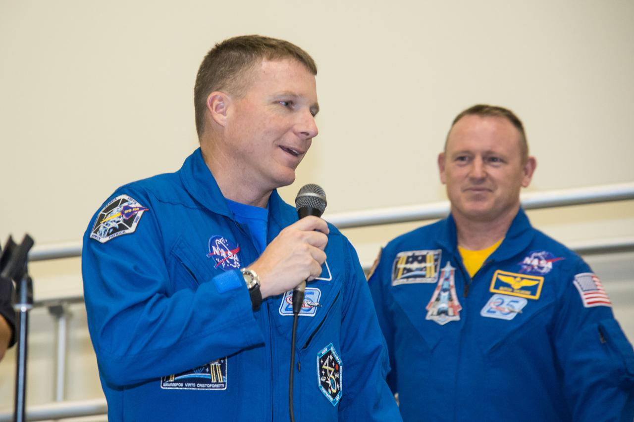 PHOTO DATE: 09 July 2014 LOCATION: Bldg. 5 - Space Station Training Facility High Bay SUBJECT: Expedition 42/43 cake cutting ceremony Soyuz 40(Soyuz 40(Alexander Samokutyaev, Yelena Serova, Barry Wilmore) & Soyuz 41(Anton Shkaplerov, Samantha Cristoforetti, Terry Virts) with ISS trainers. PHOTOGRAPHER: Mark Sowa