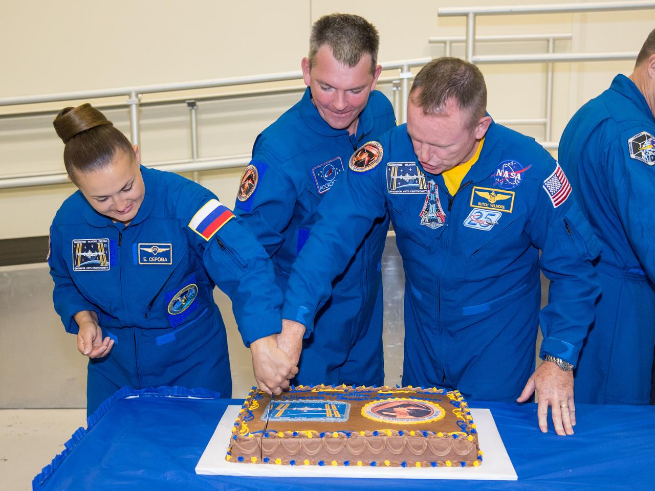 PHOTO DATE: 09 July 2014 LOCATION: Bldg. 5 - Space Station Training Facility High Bay SUBJECT: Expedition 42/43 cake cutting ceremony Soyuz 40(Soyuz 40(Alexander Samokutyaev, Yelena Serova, Barry Wilmore) & Soyuz 41(Anton Shkaplerov, Samantha Cristoforetti, Terry Virts) with ISS trainers. PHOTOGRAPHER: Mark Sowa