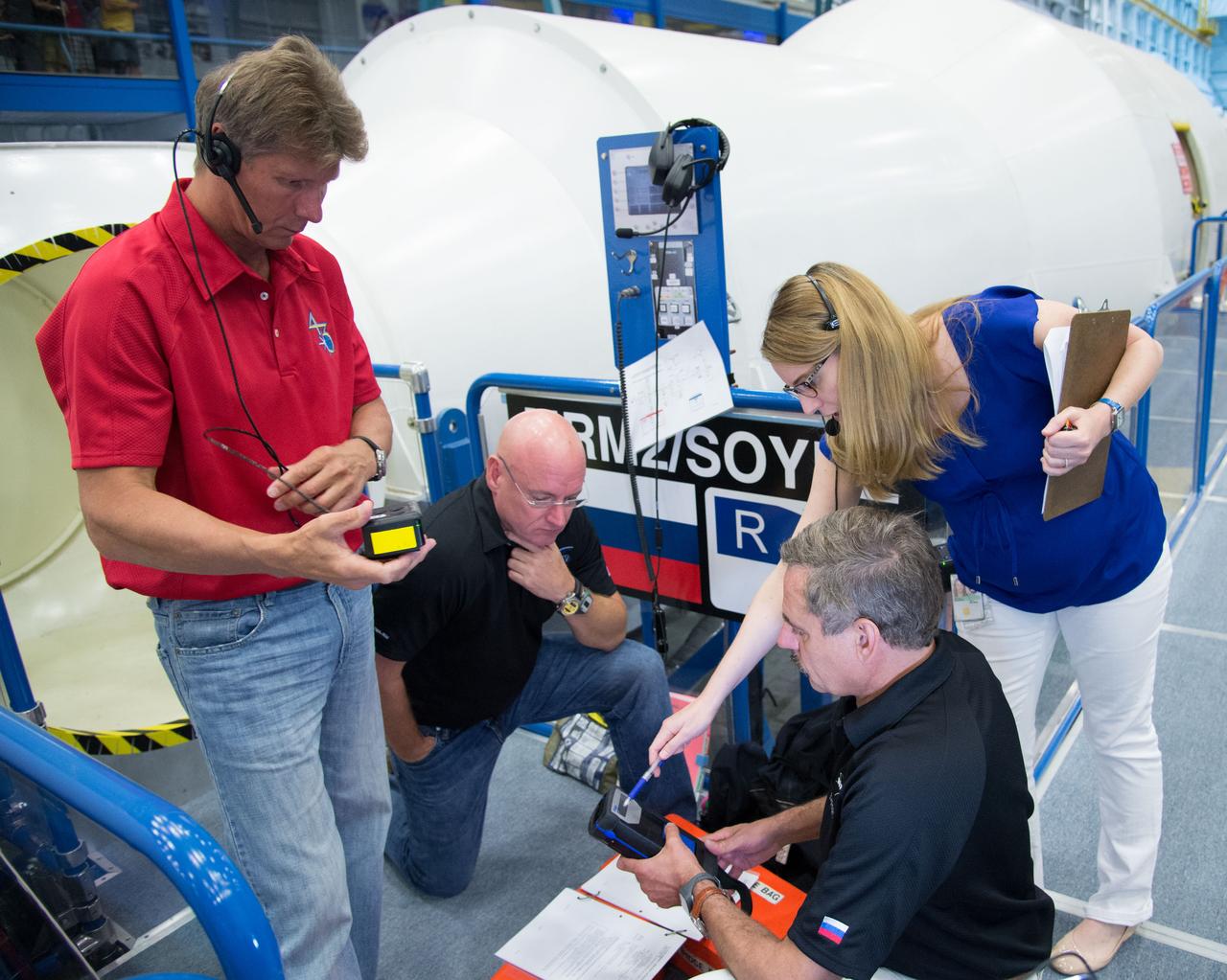 Expedition 43 Emergency Scenarios training in ISS mockups with Soyuz 41(Anton Shkaplerov, Samantha Cristoforetti, Terry Virts) and Soyuz 42 (Gennady Padalka, Mikhail Kornienko, Scott Kelly).  Photo Date: July 10, 2014.  Location: Building 9NW - ISS Mockups.  Photographer: Robert Markowitz