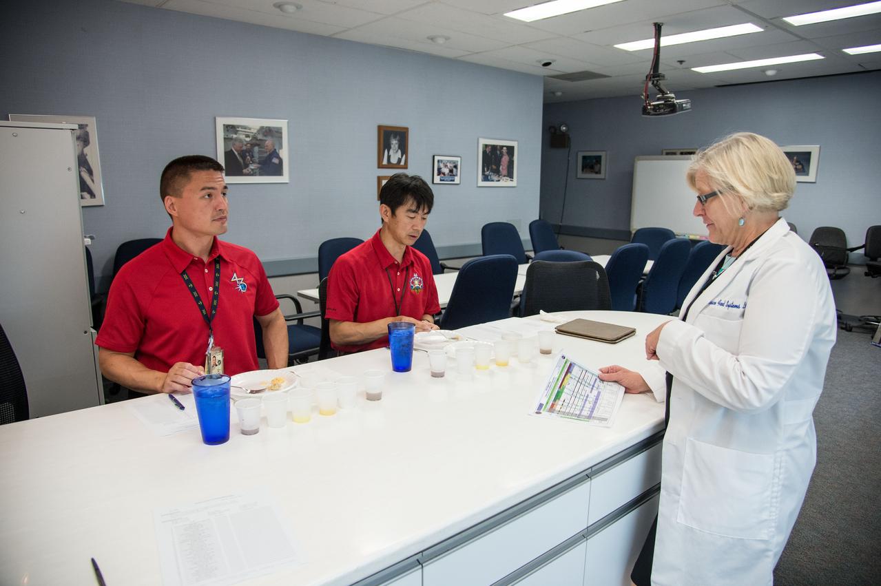 PHOTO DATE: 07-10-14 LOCATION: Bldg. 17, Room 1070 - Food Lab SUBJECT: Soyuz 43 (Expedition 44/45) crew members Kjell Lindgren and Kimiya Yui during Food Tasting #2. PHOTOGRAPHER: BILL STAFFORD