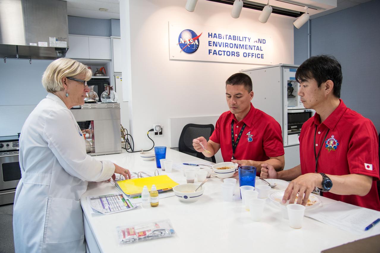 PHOTO DATE: 07-10-14 LOCATION: Bldg. 17, Room 1070 - Food Lab SUBJECT: Soyuz 43 (Expedition 44/45) crew members Kjell Lindgren and Kimiya Yui during Food Tasting #2. PHOTOGRAPHER: BILL STAFFORD
