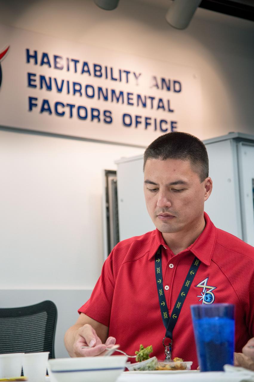 PHOTO DATE:  07-10-14 LOCATION:  Bldg. 17, Room 1070 - Food Lab  SUBJECT:  Soyuz 43 (Expedition 44/45) crew members Kjell Lindgren and Kimiya Yui during Food Tasting #2. PHOTOGRAPHER: BILL STAFFORD