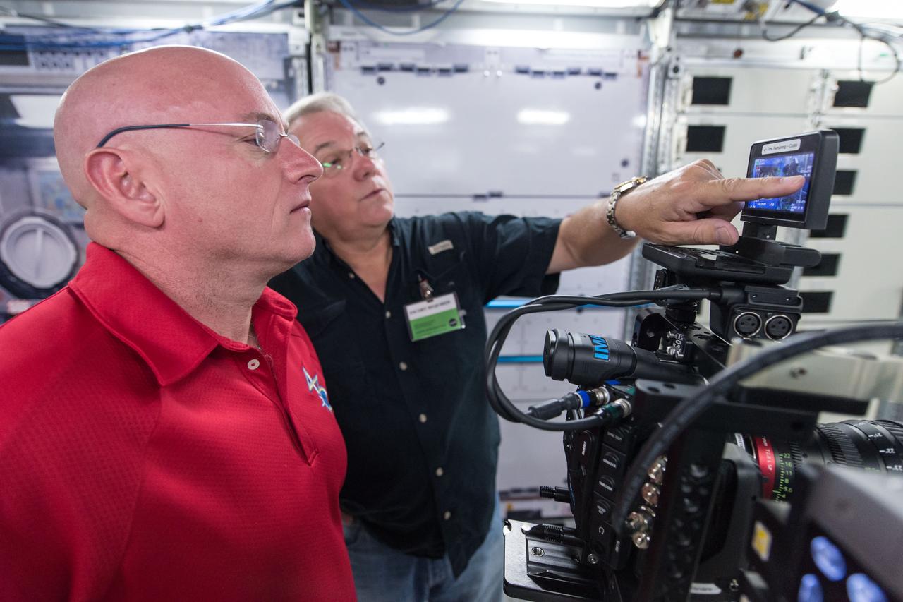 DATE: 8-5-14 LOCATION: Bldg 9, ISS mockups SUBJECT: Expedition (45/46) commander Scott Kelly during IMAX camera training with IMAX instructors and Mark Turner. PHOTOGRAPHER: Lauren Harnett