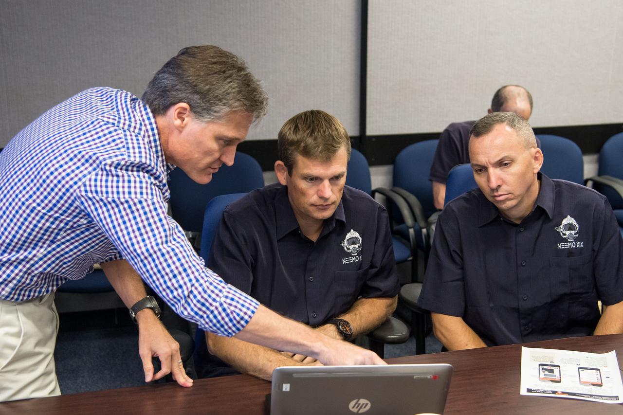 Date: 08-21-14 Location: Bldg 36, 131 Subject: ESA Astronaut Andreas Mogensen and NASA astronaut Randy Bresnik during NEEMO 19 communications training with instructors Marcum Reagan and Barbara Janoiko Photographer: James Blair