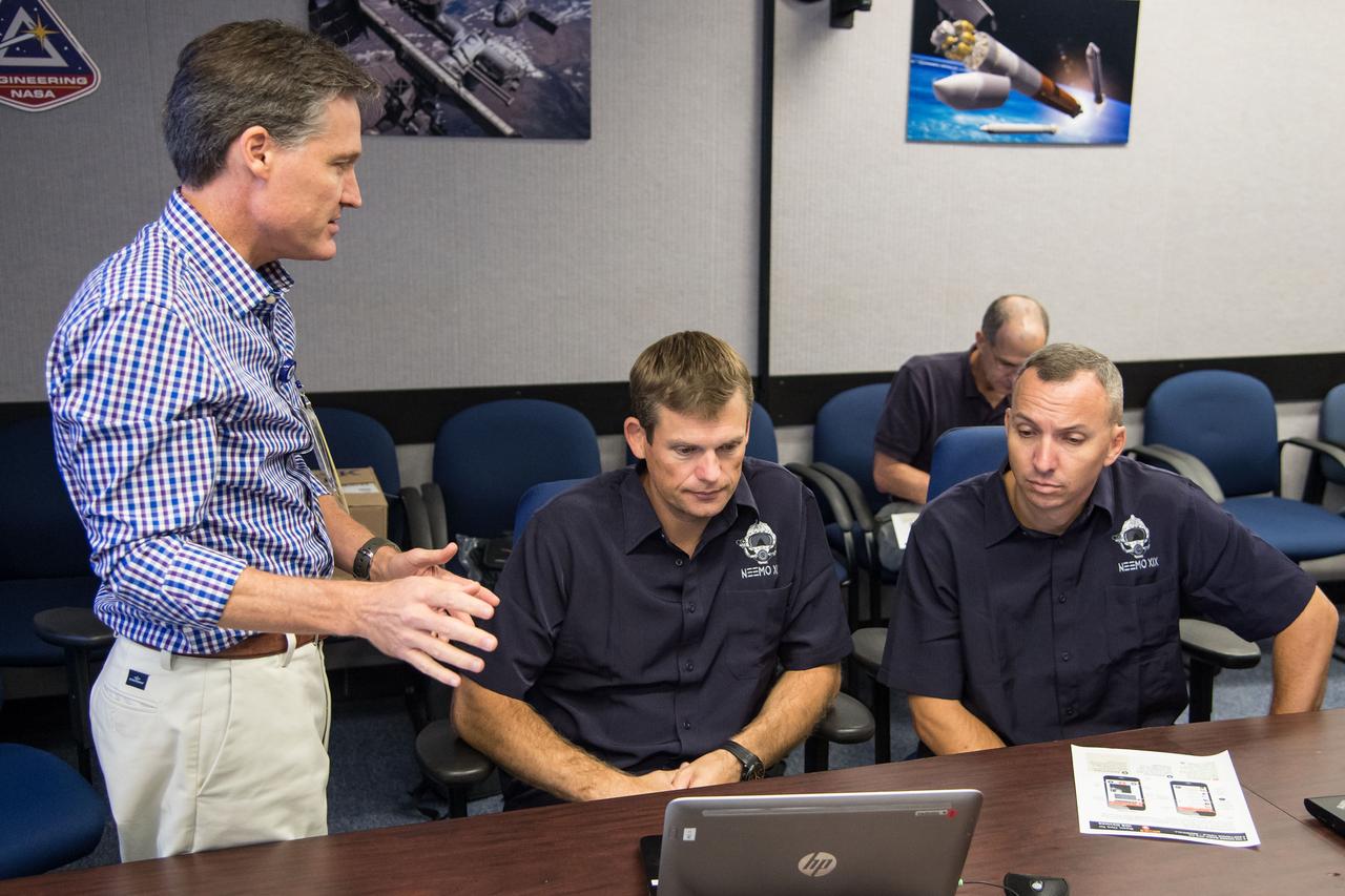 Date: 08-21-14 Location: Bldg 36, 131 Subject: ESA Astronaut Andreas Mogensen and NASA astronaut Randy Bresnik during NEEMO 19 communications training with instructors Marcum Reagan and Barbara Janoiko Photographer: James Blair