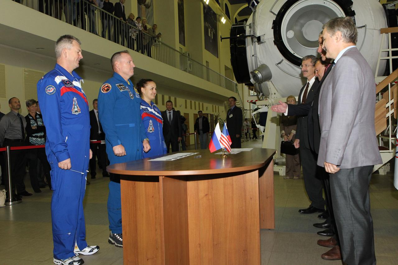1863:  At the Gagarin Cosmonaut Training Center in Star City, Russia, Expedition 41/42 prime crewmembers Alexander Samokutyaev of the Russian Federal Space Agency (left), NASA’s Barry Wilmore (center) and Elena Serova of Roscosmos (right) listen to instructions from officials September 3 at the start of final qualification exams. They will launch September 26 from the Baikonur Cosmodrome in Kazakhstan, Kazakh time, in the Soyuz TMA-14M spacecraft for a 5 ½ month mission on the International Space Station. Serova will become only the fourth Russian woman to fly in space and the first Russian woman to conduct a long duration mission on the station.  NASA/Stephanie Stoll 